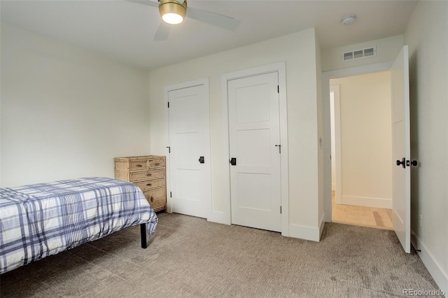 carpeted bedroom featuring ceiling fan