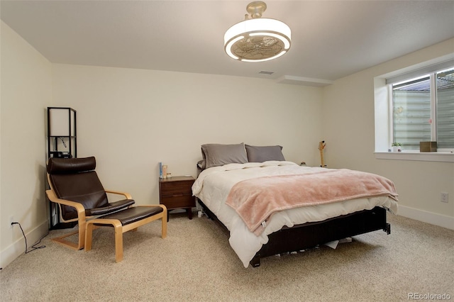 bedroom featuring light carpet