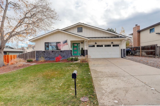 view of front facade with a garage and a front lawn