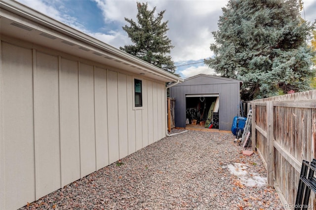 view of property exterior featuring a storage shed