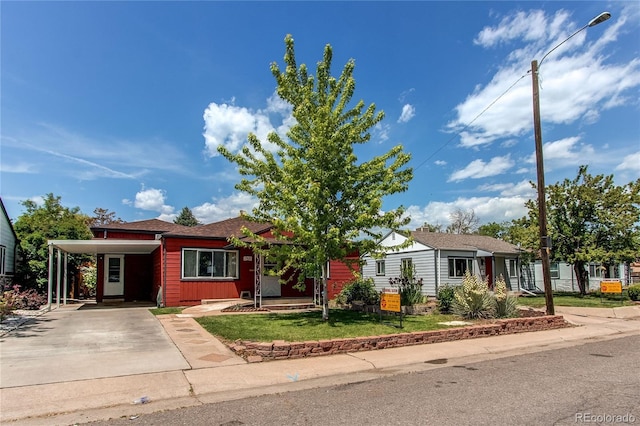 753 S Utica St, Denver, CO 80219 - view of front of property featuring driveway, a carport, and a front yard