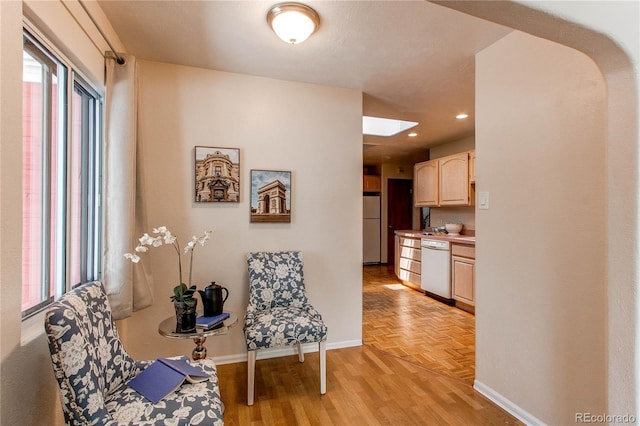 753 S Utica St, Denver, CO 80219 - living area with baseboards, parquet floors, arched walkways, and recessed lighting