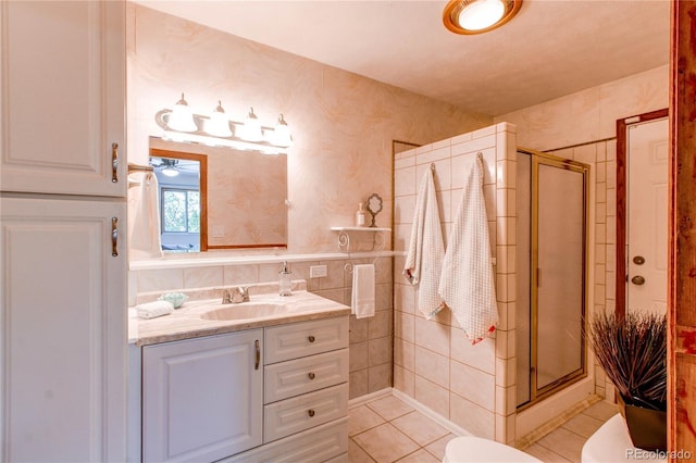 753 S Utica St, Denver, CO 80219 - bathroom featuring a shower stall, wallpapered walls, vanity, toilet, and tile patterned floors