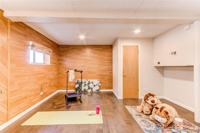 753 S Utica St, Denver, CO 80219 - exercise area featuring wooden walls, baseboards, wood finished floors, and recessed lighting
