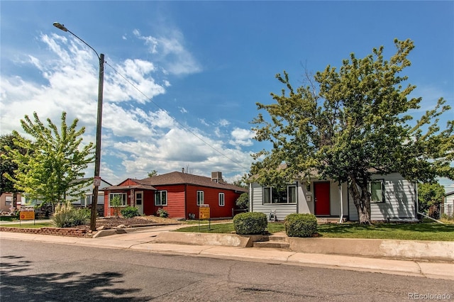 753 S Utica St, Denver, CO 80219 - view of front facade with a front yard