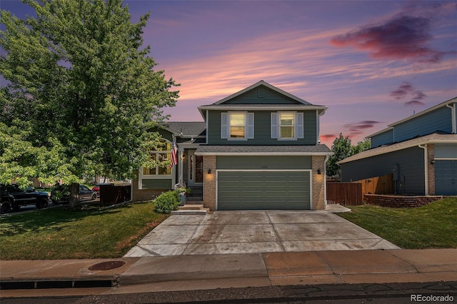 5102 S Lisbon Way, Centennial, CO 80015 - view of front facade featuring brick siding, a garage, and concrete driveway