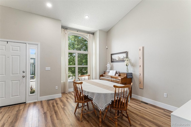 5102 S Lisbon Way, Centennial, CO 80015 - dining area featuring wood finished floors and recessed lighting