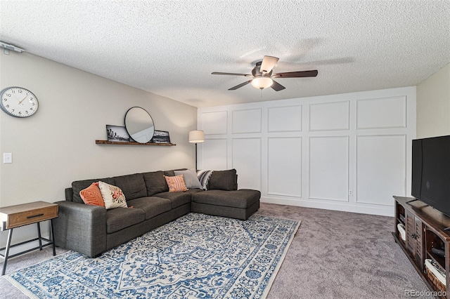 5102 S Lisbon Way, Centennial, CO 80015 - living room with a ceiling fan, carpet floors, and a textured ceiling