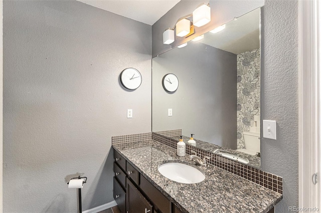 5102 S Lisbon Way, Centennial, CO 80015 - bathroom featuring vanity and a textured wall