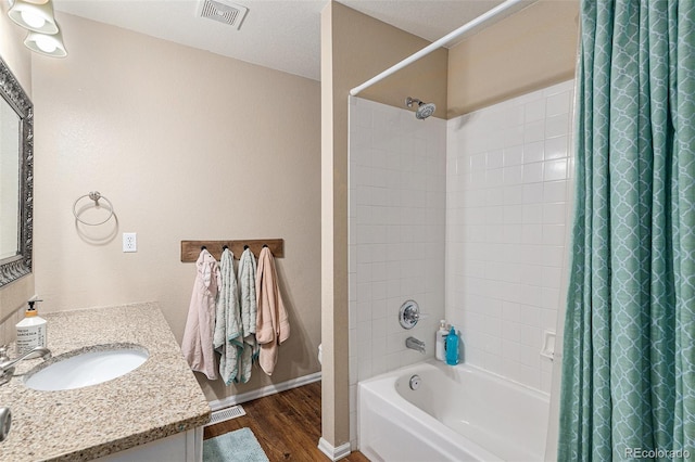 5102 S Lisbon Way, Centennial, CO 80015 - bathroom with wood finished floors, shower / bath combo with shower curtain, and vanity