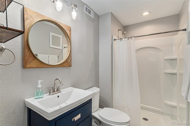 5102 S Lisbon Way, Centennial, CO 80015 - full bathroom featuring a textured wall, vanity, and a shower with curtain