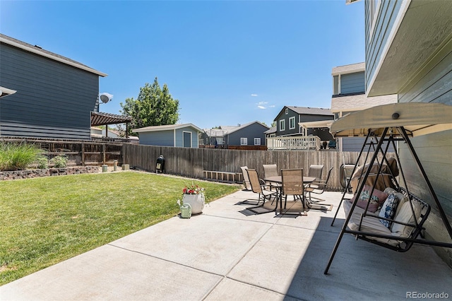 5102 S Lisbon Way, Centennial, CO 80015 - fenced backyard with a patio area, outdoor dining area, and a residential view