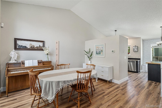 5102 S Lisbon Way, Centennial, CO 80015 - dining space featuring light wood-style floors and high vaulted ceiling
