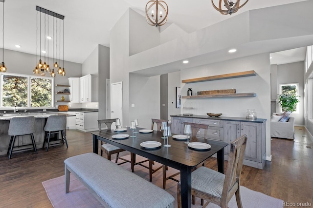 166 S Rainbow Trl, Evergreen, CO 80439 - dining area with a towering ceiling, a chandelier, dark wood-style flooring, and recessed lighting