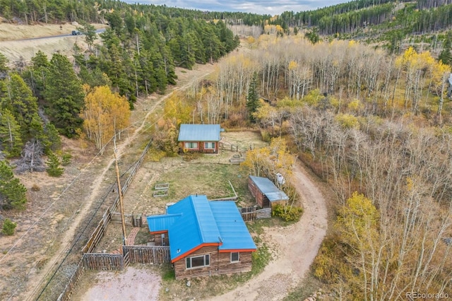 24427 Peak To Peak Hwy, Nederland, CO 80466 - view of subject property featuring a heavily wooded area