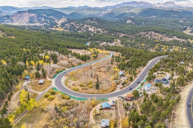24427 Peak To Peak Hwy, Nederland, CO 80466 - aerial overview of property's location featuring mountains and a heavily wooded area
