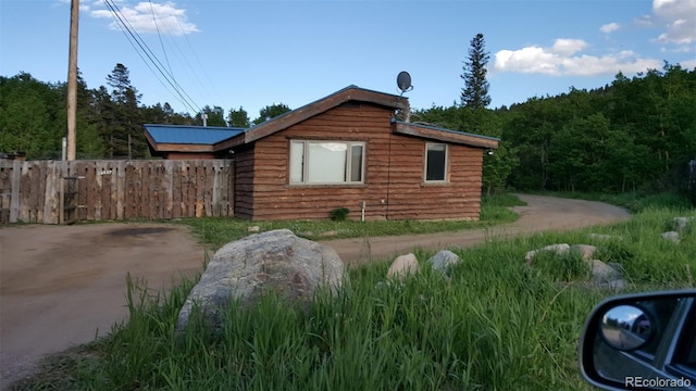 24427 Peak To Peak Hwy, Nederland, CO 80466 - view of side of home featuring fence