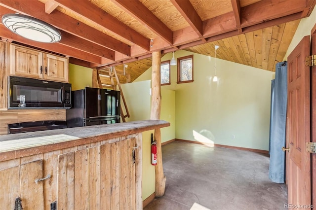 24427 Peak To Peak Hwy, Nederland, CO 80466 - kitchen with black appliances, tile counters, concrete flooring, baseboards, and vaulted ceiling