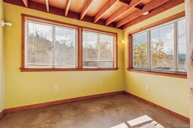 24427 Peak To Peak Hwy, Nederland, CO 80466 - unfurnished room with baseboards, unfinished concrete flooring, and beam ceiling