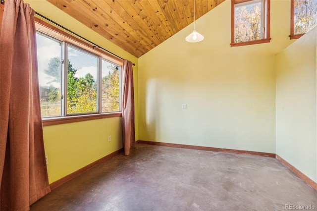 24427 Peak To Peak Hwy, Nederland, CO 80466 - empty room with lofted ceiling, baseboards, concrete floors, and wooden ceiling