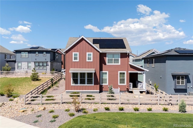 8372 Bijou Creek Ave, Littleton, CO 80125 - back of house with board and batten siding and solar panels