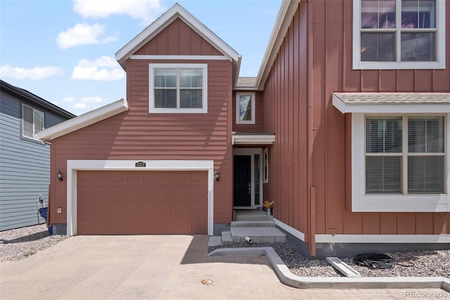 8372 Bijou Creek Ave, Littleton, CO 80125 - view of front of property featuring board and batten siding and driveway