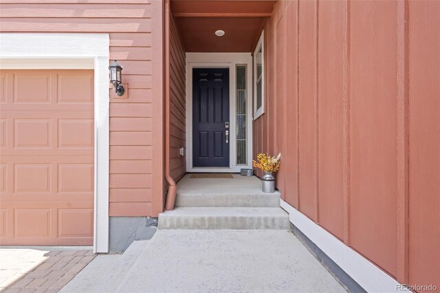 8372 Bijou Creek Ave, Littleton, CO 80125 - doorway to property featuring an attached garage