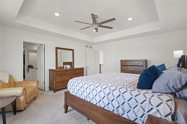 8372 Bijou Creek Ave, Littleton, CO 80125 - bedroom featuring a tray ceiling, light carpet, recessed lighting, and a ceiling fan