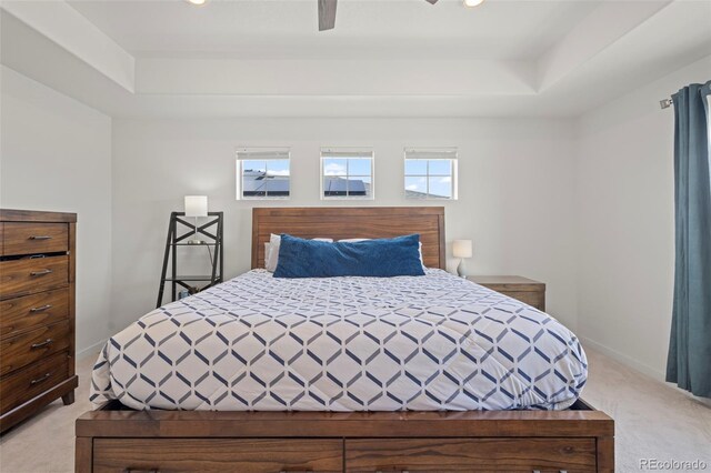 8372 Bijou Creek Ave, Littleton, CO 80125 - bedroom featuring light carpet, a raised ceiling, baseboards, ceiling fan, and recessed lighting