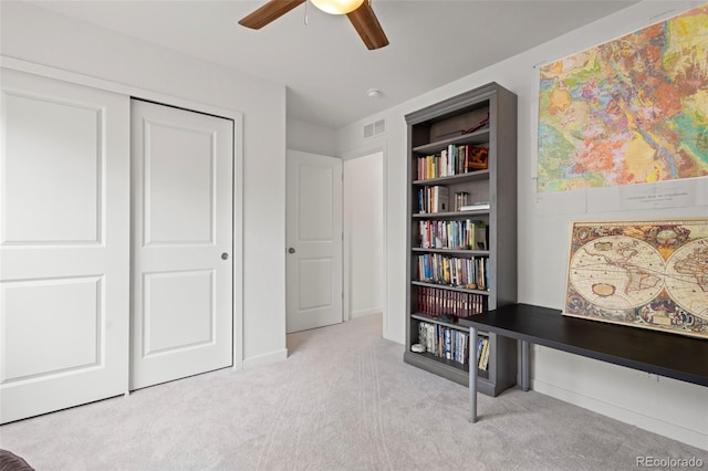 8372 Bijou Creek Ave, Littleton, CO 80125 - living area featuring carpet, a ceiling fan, built in features, and baseboards