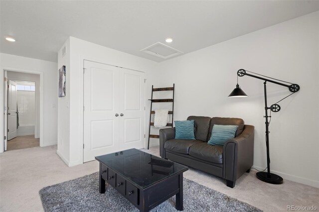8372 Bijou Creek Ave, Littleton, CO 80125 - living area featuring light carpet, baseboards, attic access, and recessed lighting