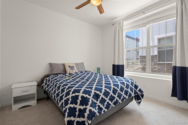 8372 Bijou Creek Ave, Littleton, CO 80125 - carpeted bedroom featuring a ceiling fan and baseboards