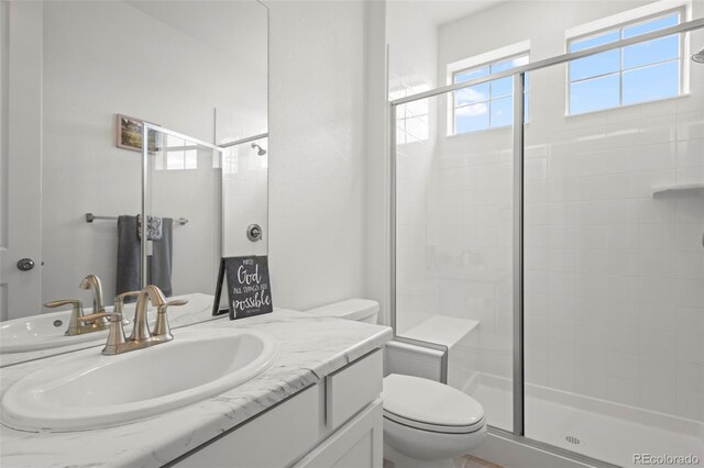 8372 Bijou Creek Ave, Littleton, CO 80125 - full bath featuring a stall shower, toilet, and vanity