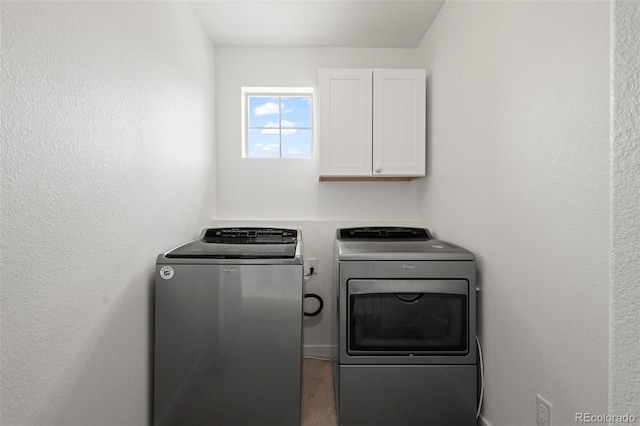 8372 Bijou Creek Ave, Littleton, CO 80125 - clothes washing area with cabinet space and washer and clothes dryer