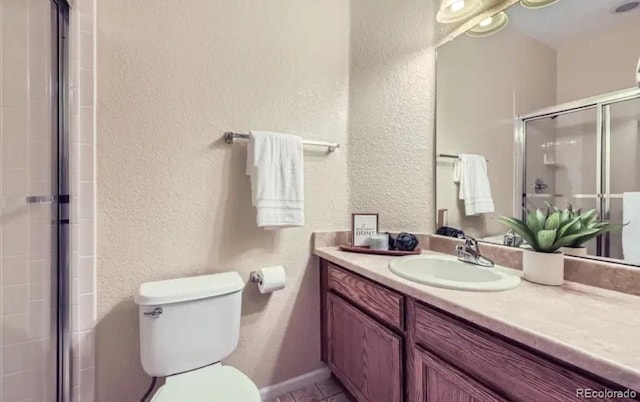 8915 Federal Blvd Unit 203, Westminster, CO 80260 - full bath featuring a textured wall, vanity, a shower stall, and toilet