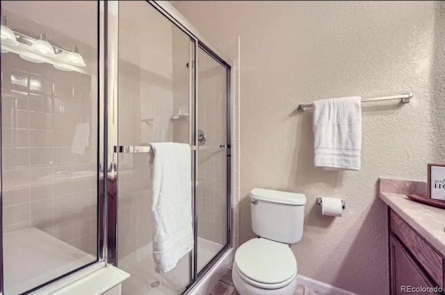 8915 Federal Blvd Unit 203, Westminster, CO 80260 - full bath with a textured wall, vanity, a shower stall, and toilet
