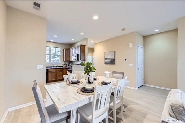 8915 Federal Blvd Unit 203, Westminster, CO 80260 - dining area with light wood-type flooring, baseboards, and recessed lighting