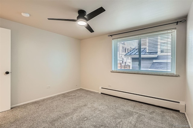 carpeted empty room with a baseboard radiator, baseboards, and a ceiling fan