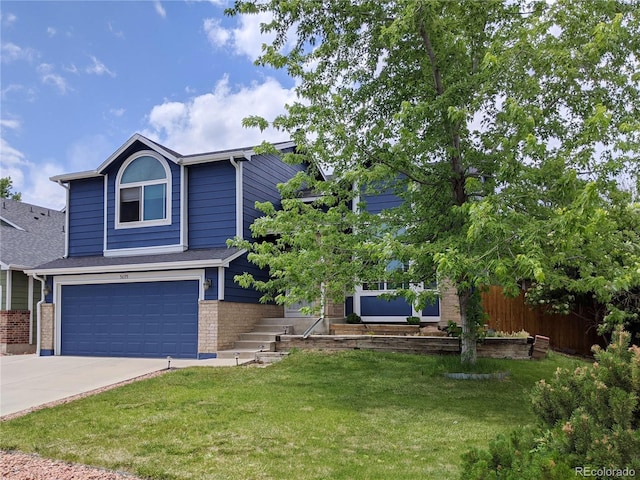 5695 W 109th Cir, Westminster, CO 80020 - view of front of property with an attached garage, concrete driveway, a front yard, and brick siding