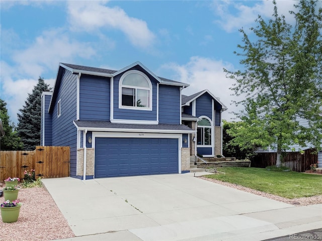 5695 W 109th Cir, Westminster, CO 80020 - view of front of home featuring a garage and driveway