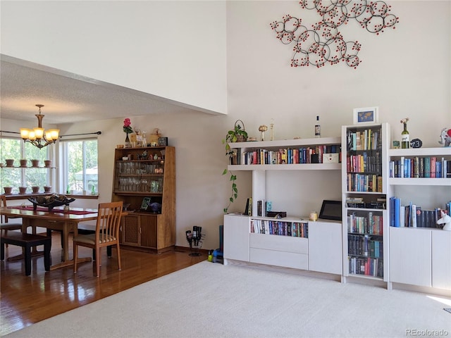 5695 W 109th Cir, Westminster, CO 80020 - carpeted dining space with a chandelier and wood finished floors