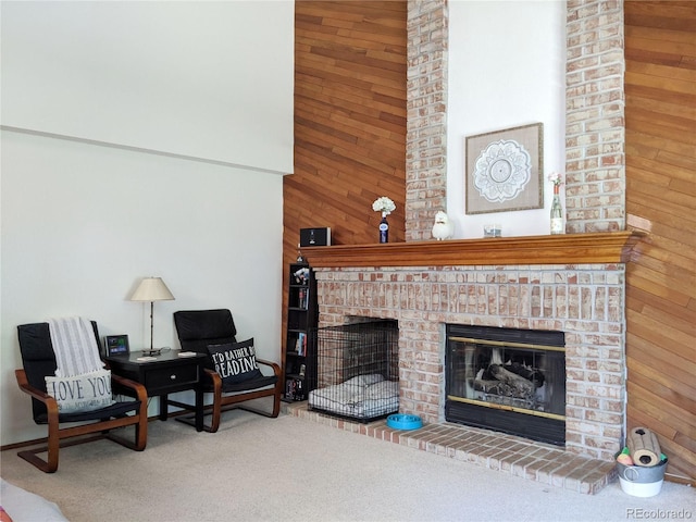 5695 W 109th Cir, Westminster, CO 80020 - carpeted living area with wood walls, a fireplace, and a high ceiling