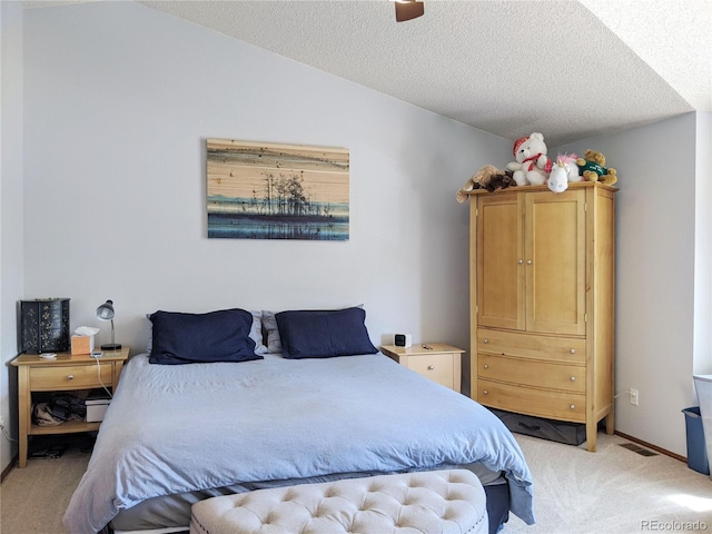 5695 W 109th Cir, Westminster, CO 80020 - bedroom with light carpet, lofted ceiling, and a textured ceiling