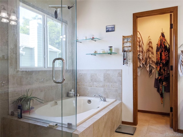 5695 W 109th Cir, Westminster, CO 80020 - full bathroom featuring tiled bath, a shower with door, and tile patterned flooring