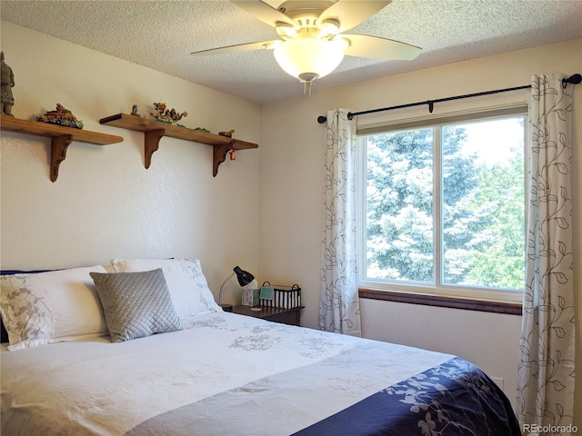 5695 W 109th Cir, Westminster, CO 80020 - bedroom featuring ceiling fan and a textured ceiling