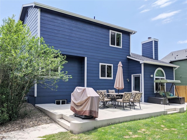 5695 W 109th Cir, Westminster, CO 80020 - rear view of property with a patio and a chimney