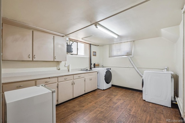 2431 S York St, Denver, CO 80210 - laundry room with cabinet space, dark wood finished floors, and washing machine and dryer