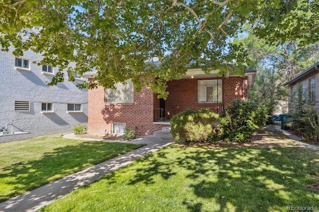 2431 S York St, Denver, CO 80210 - view of front of house with brick siding and a front lawn