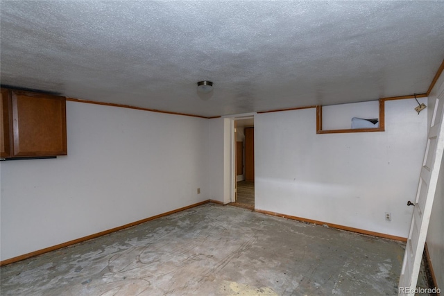 finished below grade area with a textured ceiling and baseboards