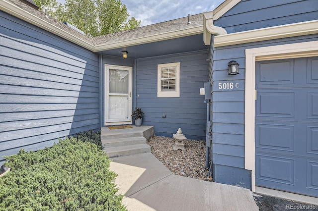 5016 S Nelson St Unit C, Littleton, CO 80127 - doorway to property with a garage